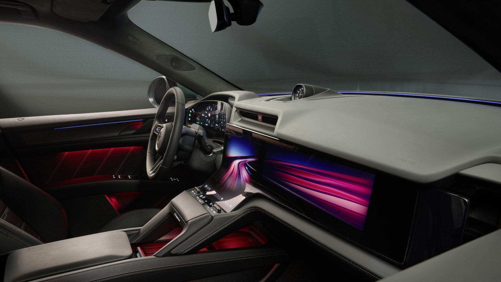 Interior of the 2026 Porsche Cayenne Turbo Electric featuring digital driver displays, ambient lighting, and a performance-oriented cockpit layout.