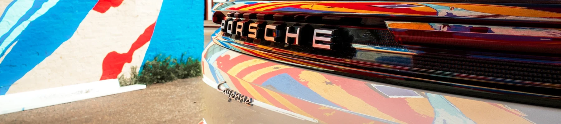 Porsche Allocation form featuring a white Cayenne in downtown Denver, Colorado.