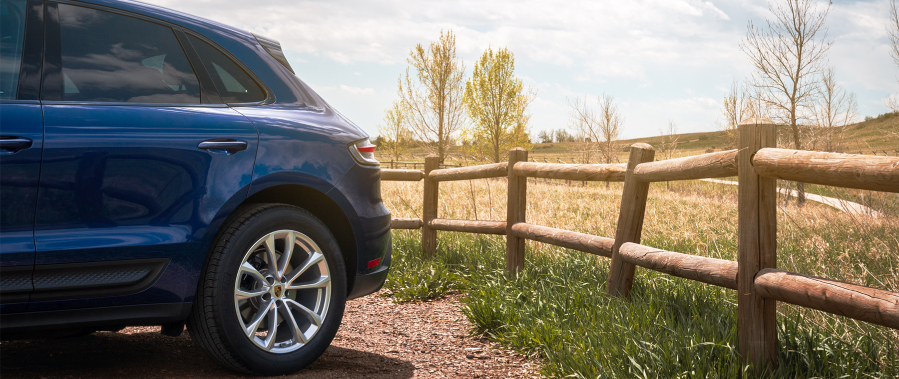 Porsche macan form featuring a Montego Blue Metallic Cayenne GTS in downtown Denver, Colorado.